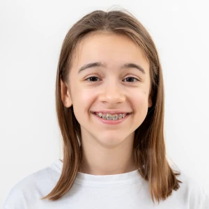 Young patient smiling with clear braces in Linden
